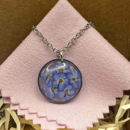 Forget me not flowers round stainless steel resin necklace