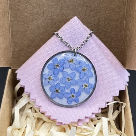 Forget me not flowers round stainless steel resin necklace