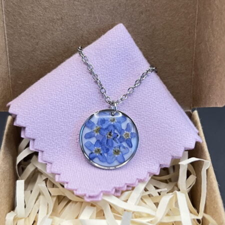 Forget me not flowers round stainless steel resin necklace