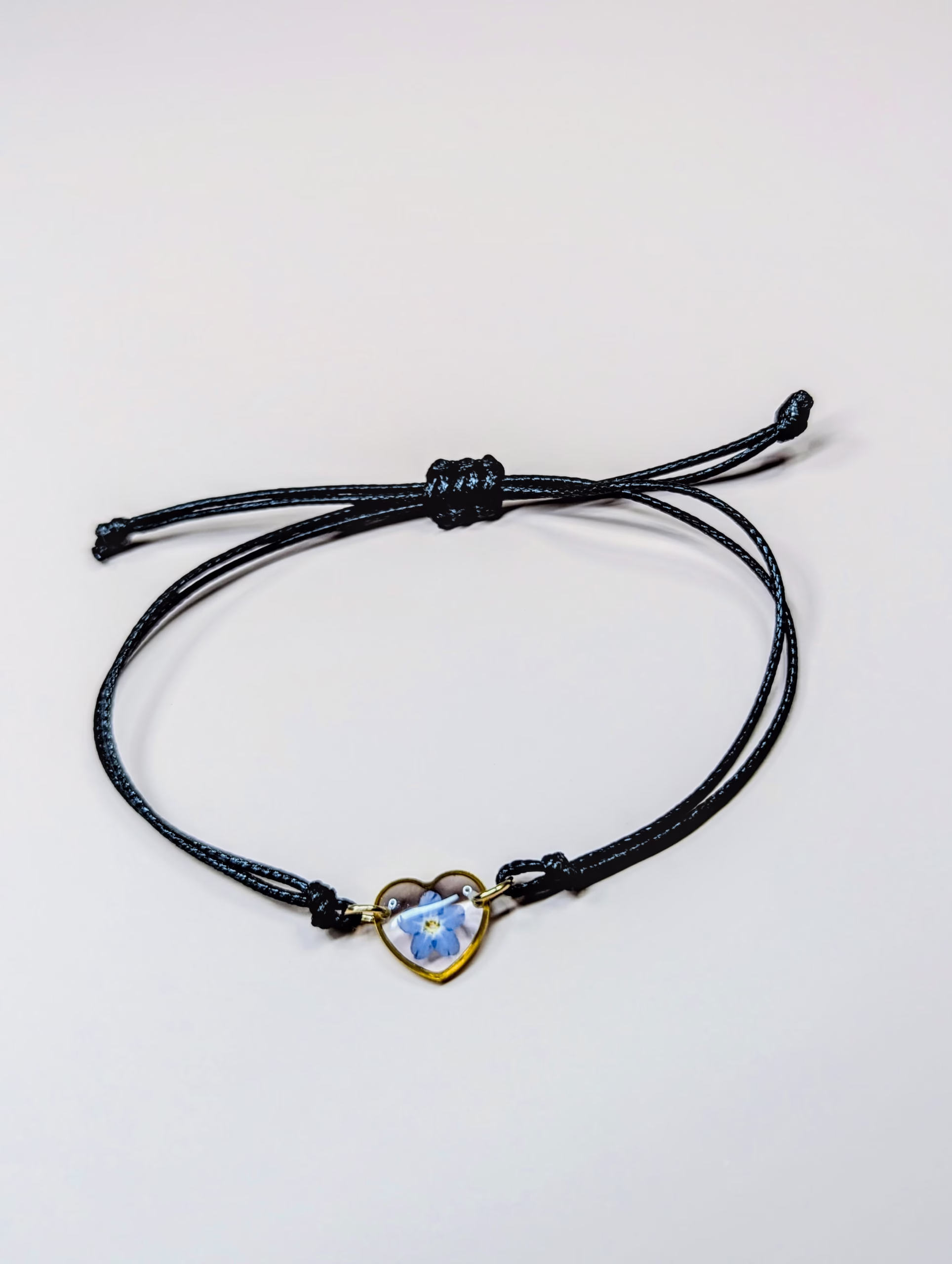 Forget me not black cord bracelet in gold - Image 4
