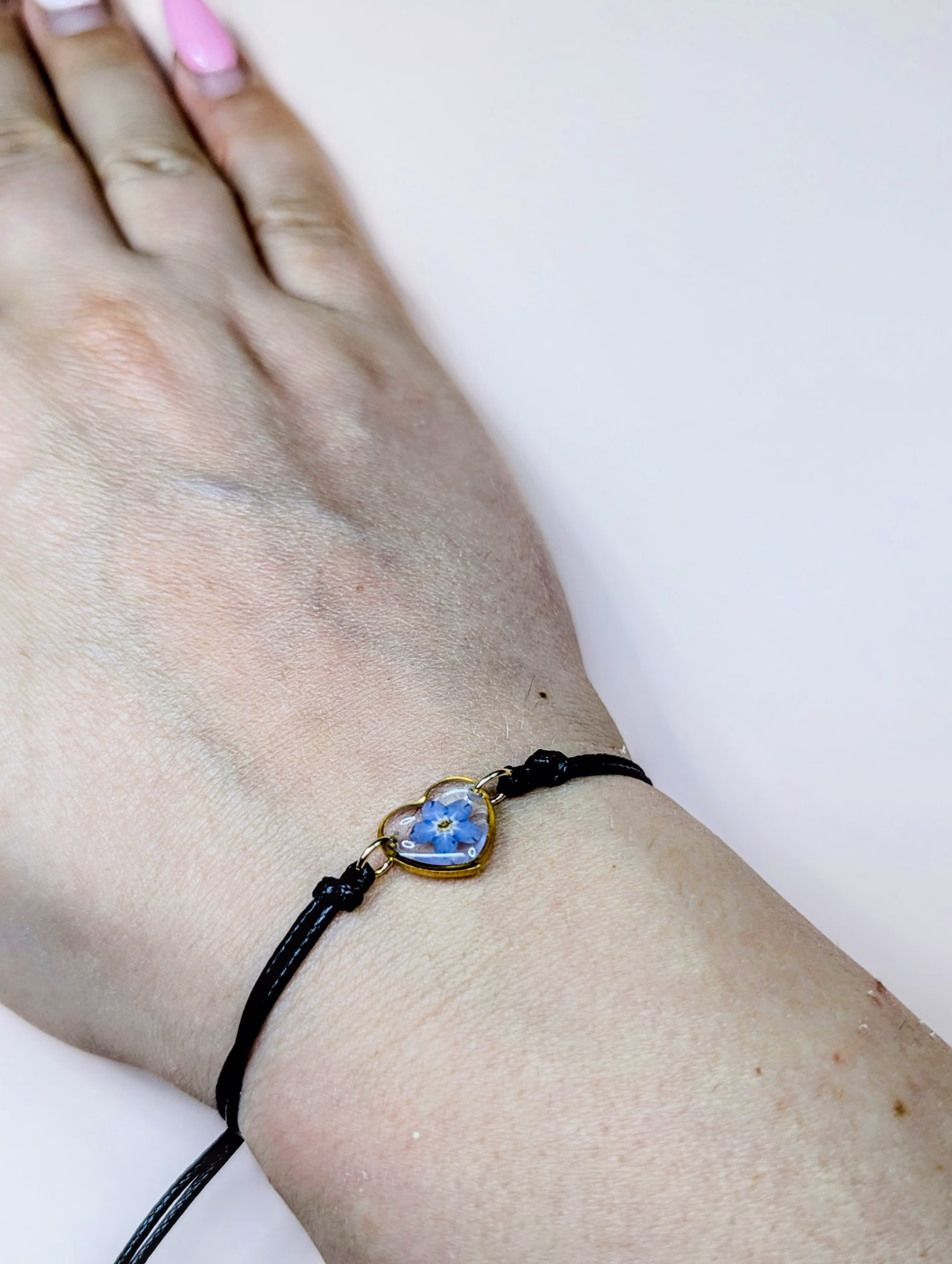 Forget me not black cord bracelet in gold - Image 3