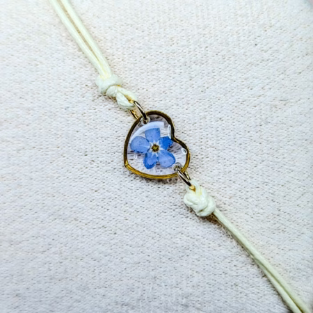 Forget me not beige cord bracelet in gold