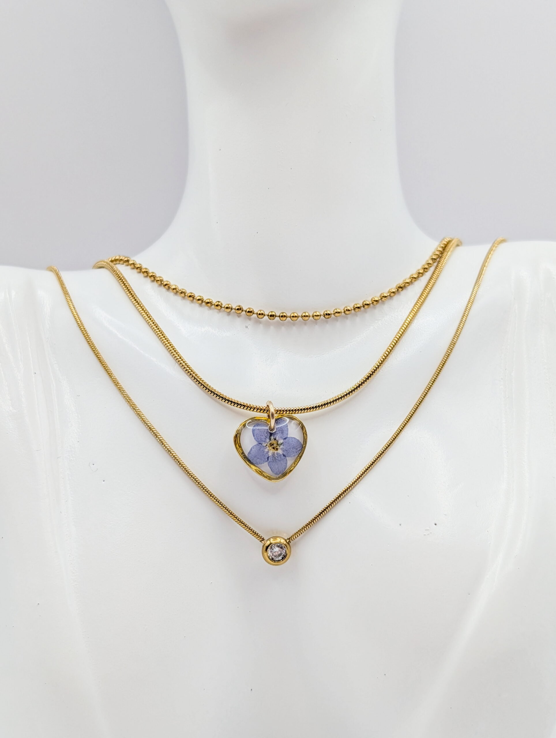 Forget me not three-layer gold necklace - white background
